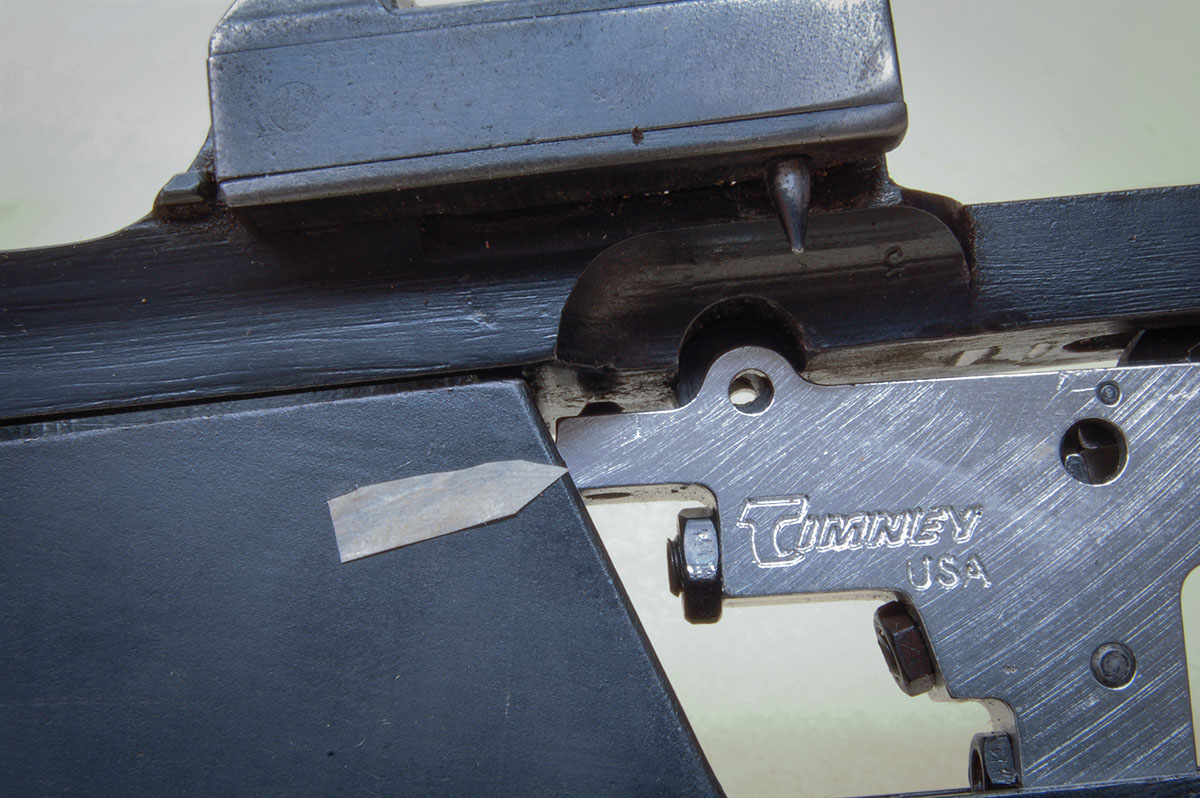 A replacement trigger housing may strike the rear of the Siamese magazine box. Simply file a bit off of the trigger housing.